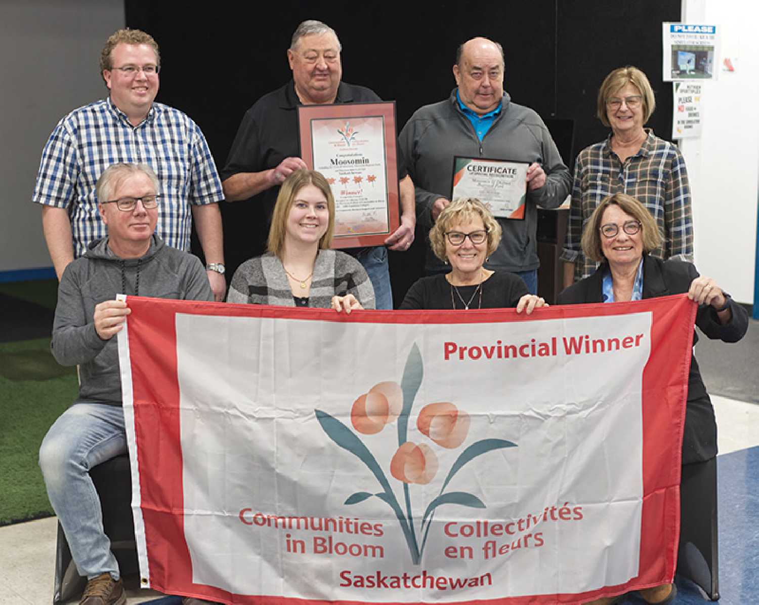 The Communities in Bloom Committee. In back from left are Andrew Exelby with Sask Parks and Rec presenting the awards and certificates of recognition, Moosomin Mayor Larry Tomlinson, Chris Davidson with the Moosomin Regional Park Board, and Pansy Taylor. In front are Moosomin Rec Director Mike Schwean, Moosomin EDO Casey McCormac, Lynn Smart, and Carol Adair.